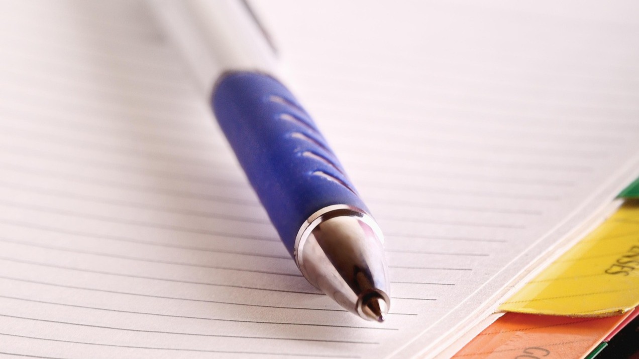 picture of a notebook and pen